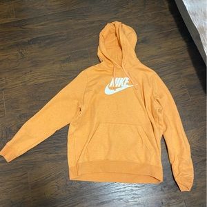 Selling this orange Nike sweater. Size W- large.Great condition never worn.
